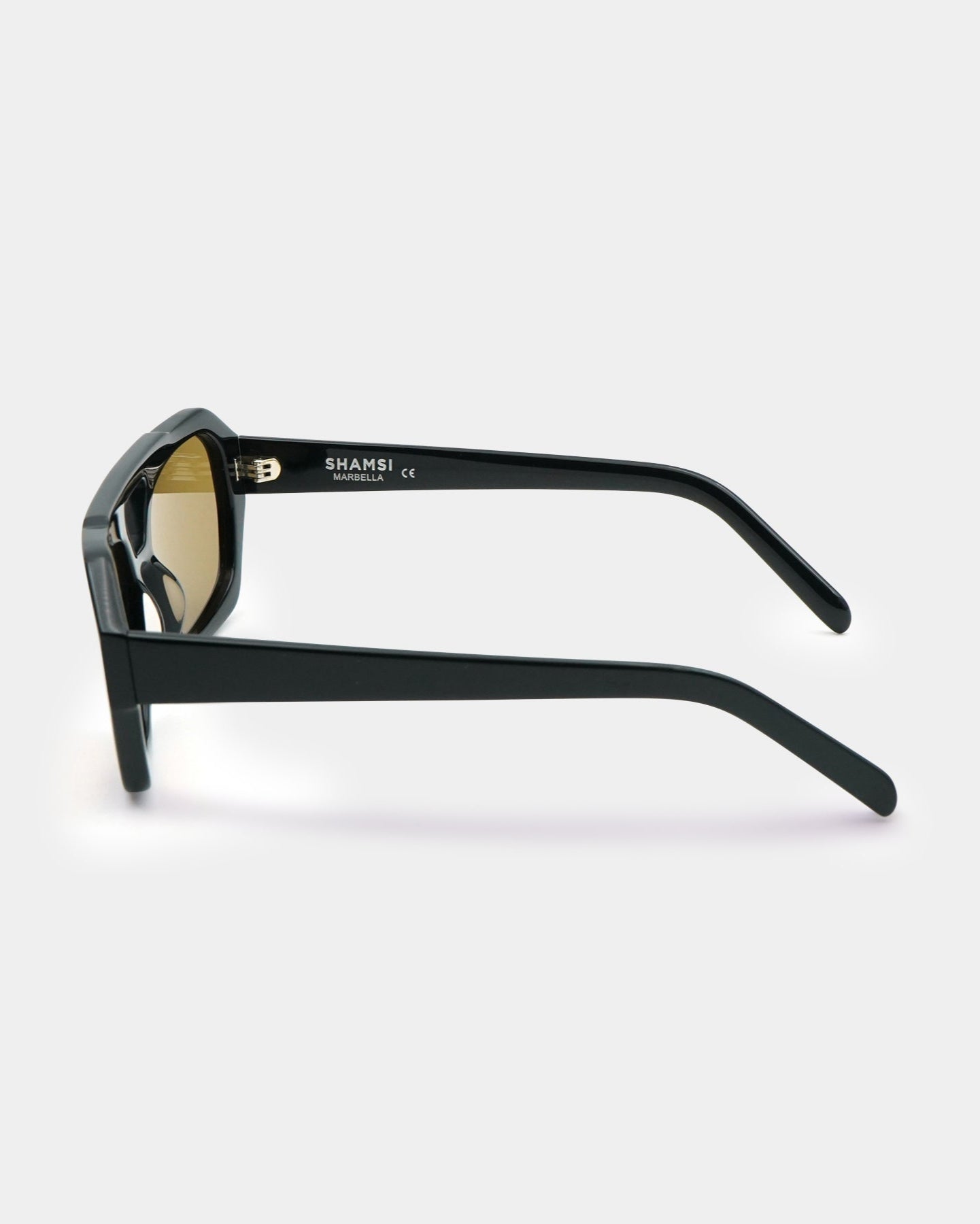 Black sunglasses with gold lenses on a white background