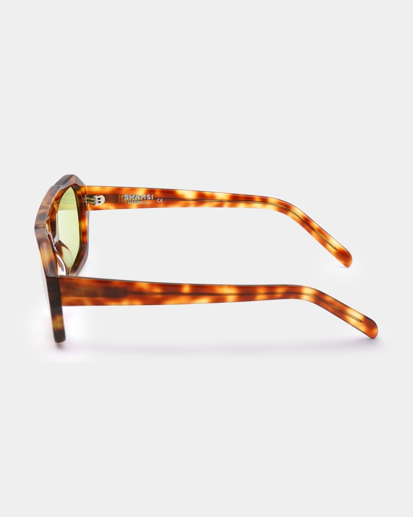 Sunglasses with tortoiseshell frame on a white background