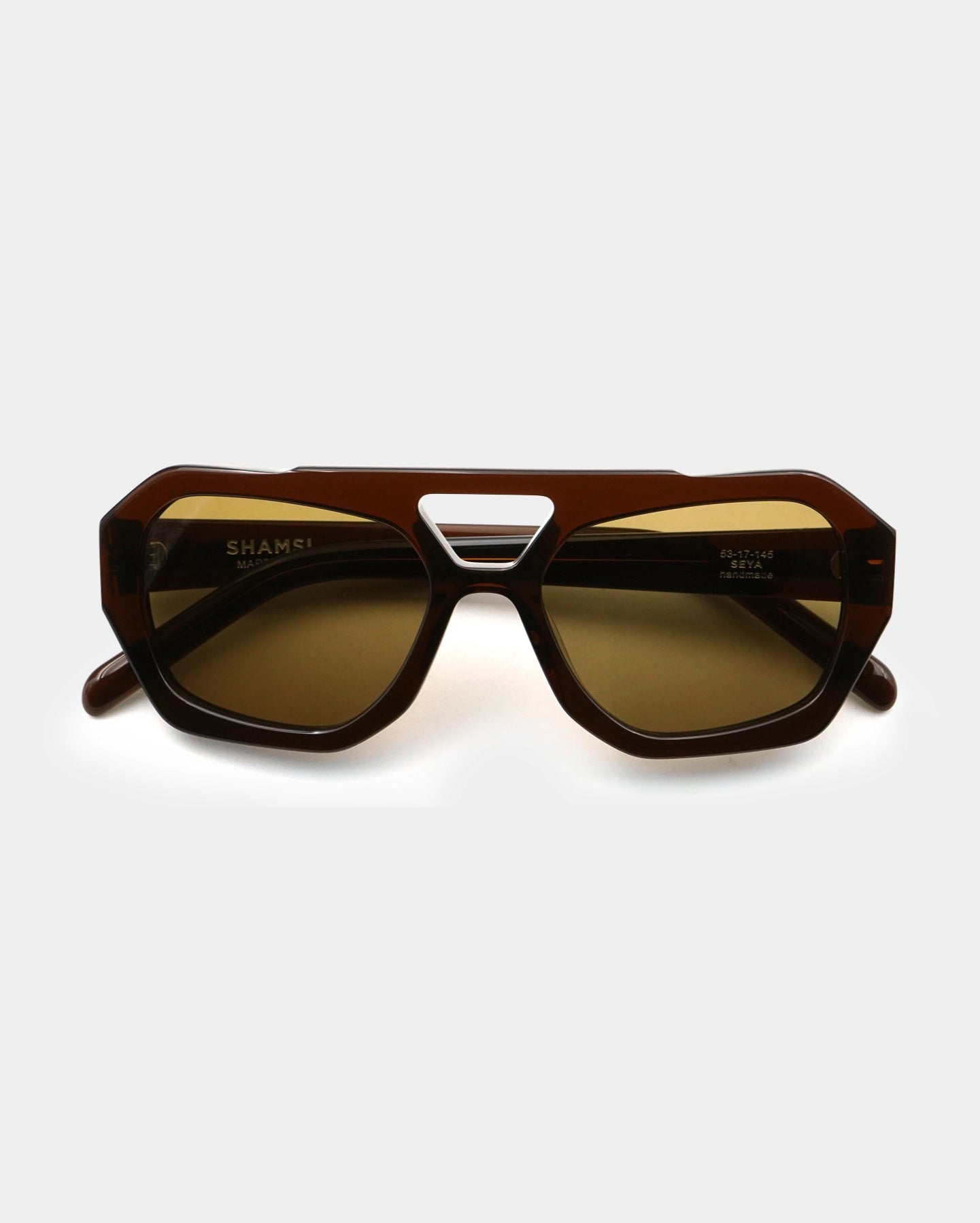 Brown sunglasses with a white background