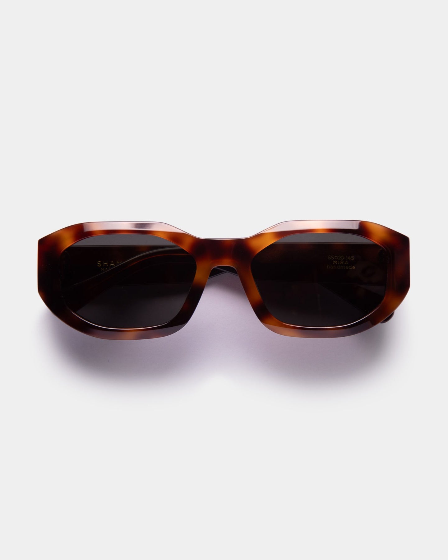 A pair of tortoise, oversized sunglasses with a bold, fashionable design.