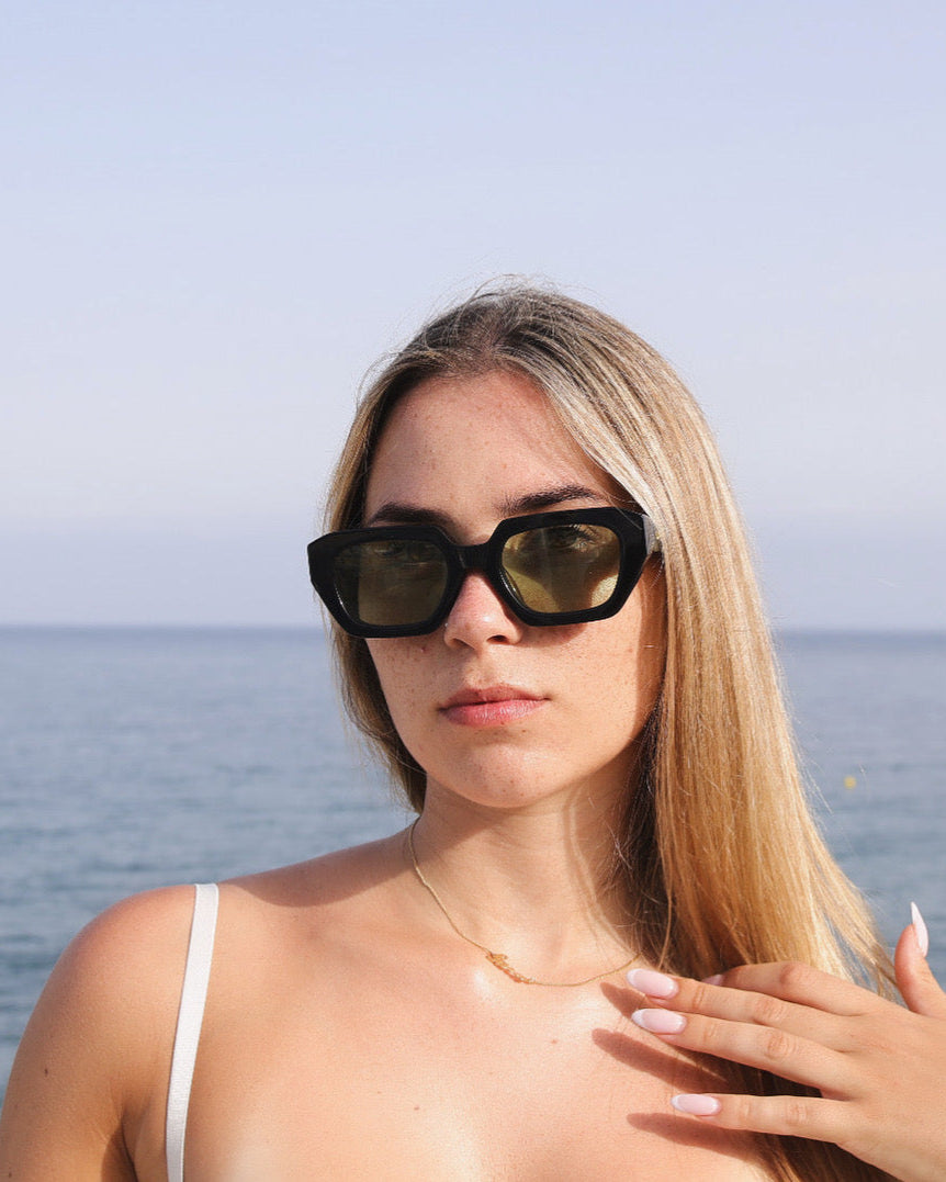Girl wearing Sima green Shamsi Sunglasses at the beach