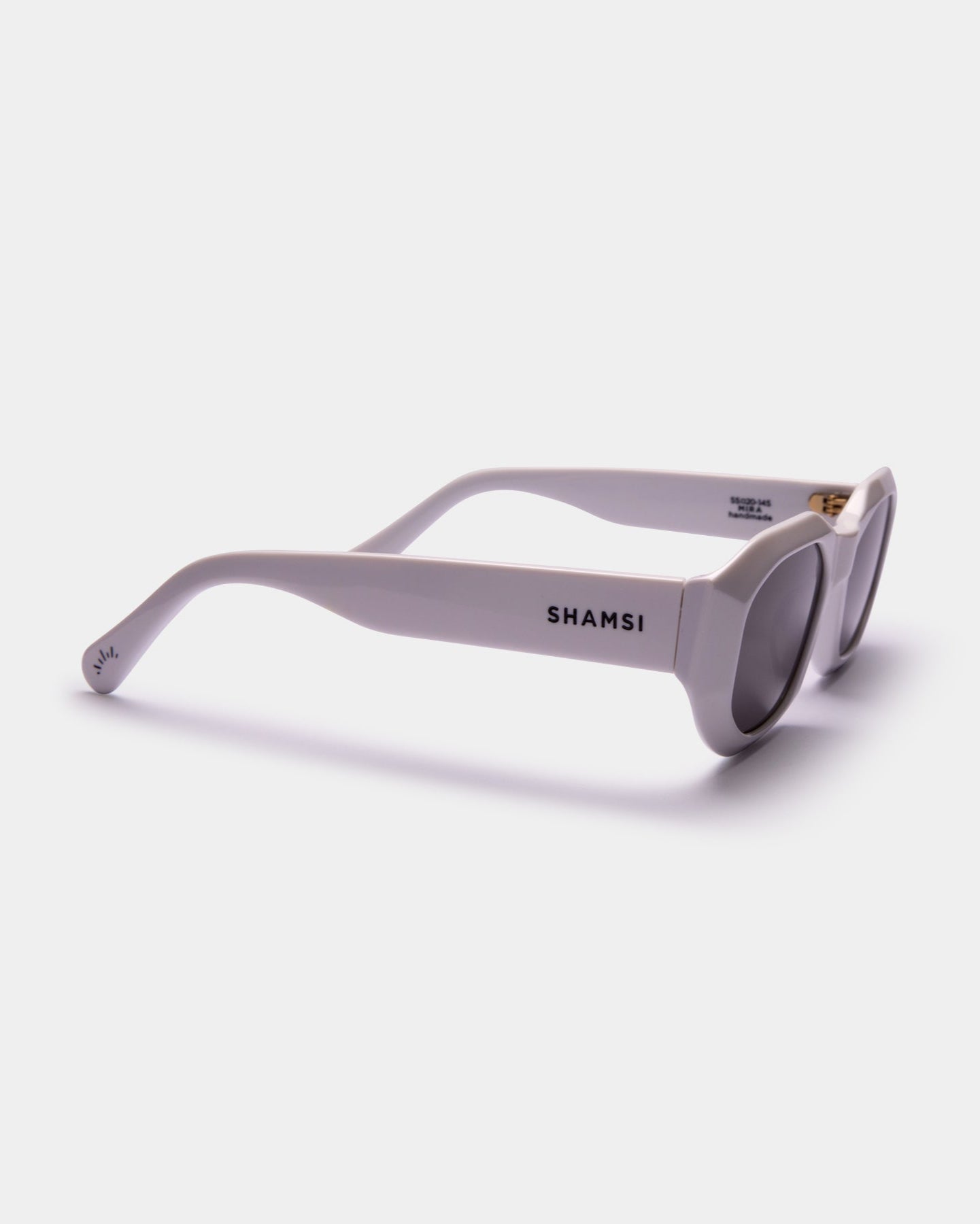 Sunglasses with 'SHAMSI' branding on a white background