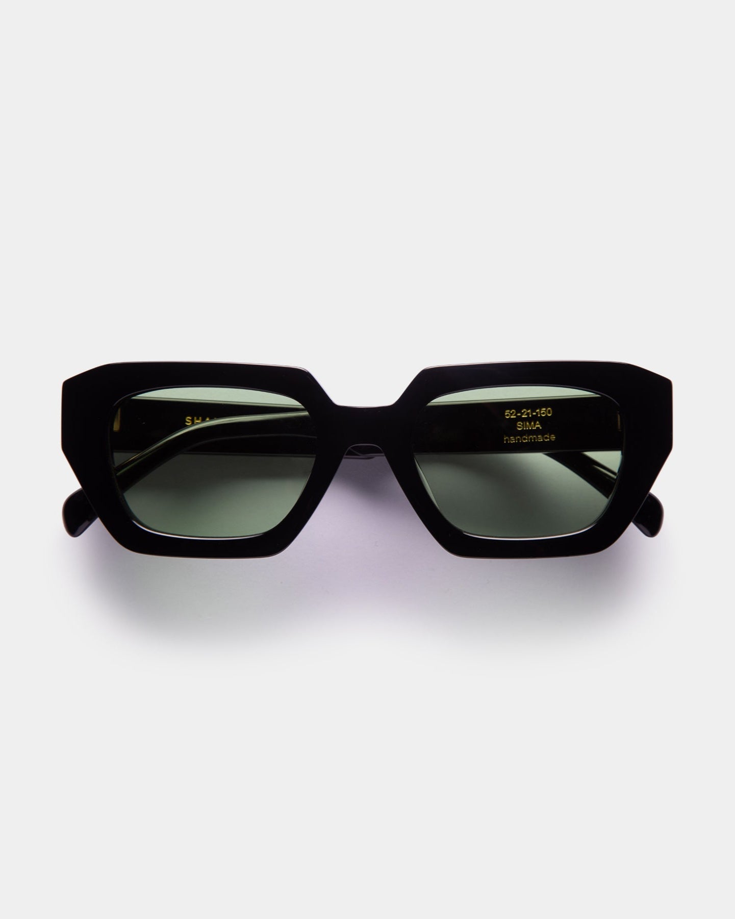 Sima green and black Shamsi Sunglasses on a white background