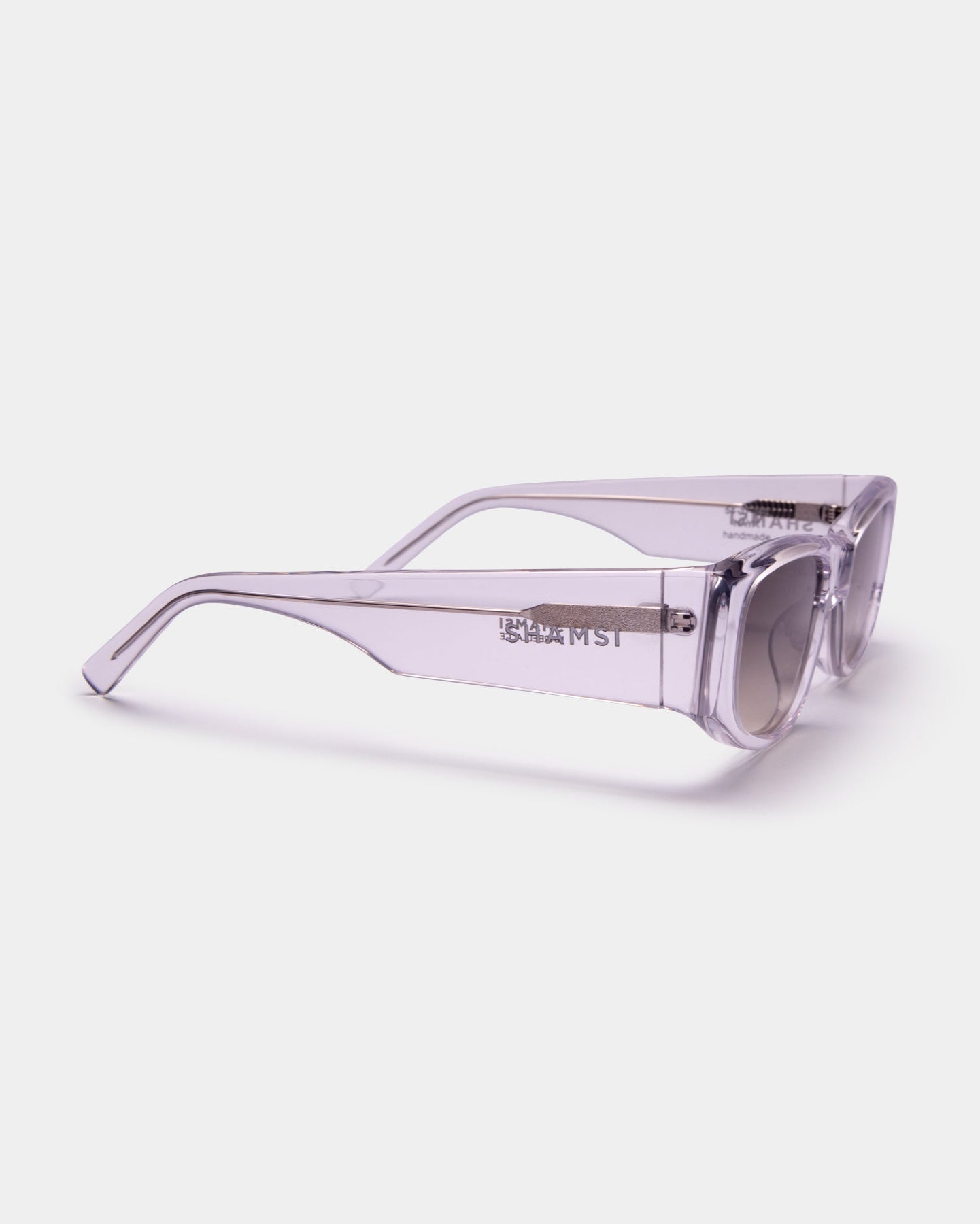 Clear sunglasses with a brand logo on a white background