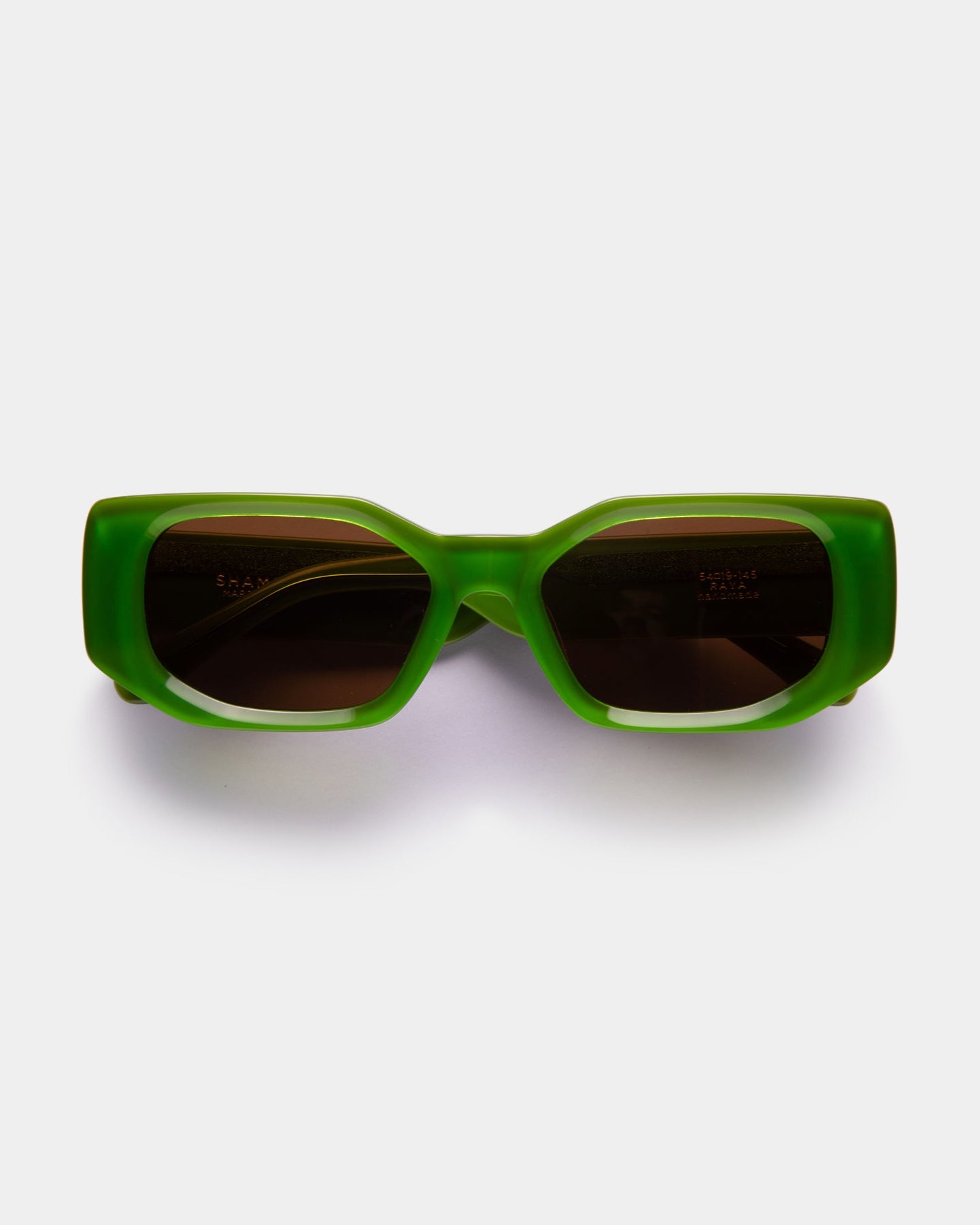 A pair of green RAYA sunglasses with a sleek design, displayed against a white background.